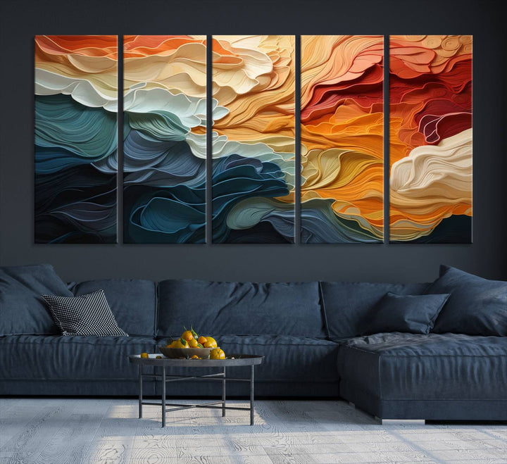 A Blue Orange Abstract Wave Wall Art Canvas Print adorns the wall. This colorful masterpiece is professionally hand-assembled to enhance any space.