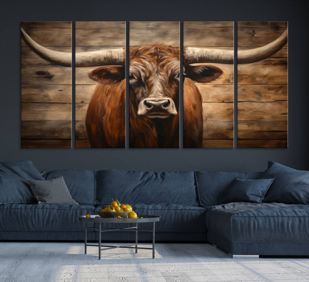 The Longhorn Bull Wall Art, a ready-to-hang canvas print, showcases an image of a brown longhorn cow set against a wooden background, perfect for those looking to enhance their space with rustic farmhouse and western barn decor.