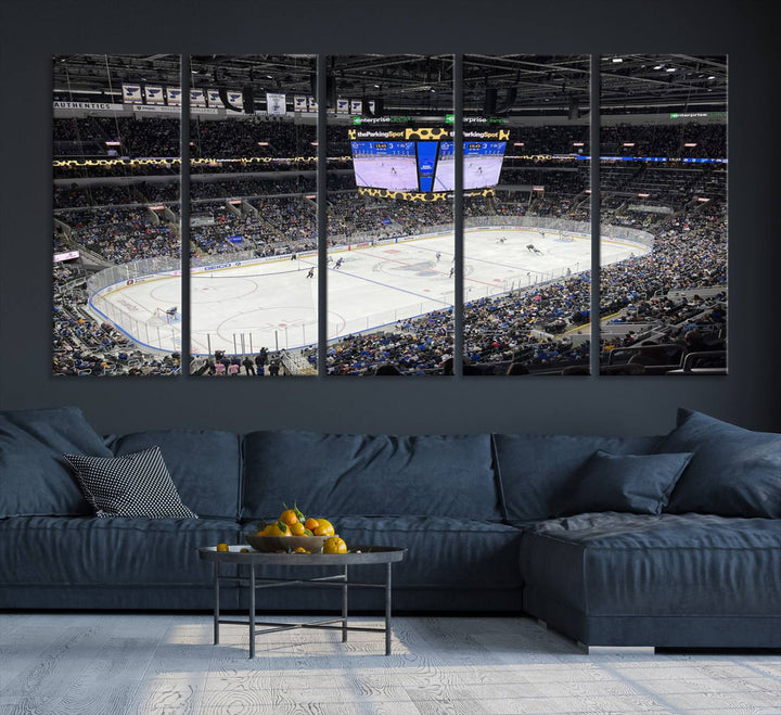 A large Enterprise Center canvas of a crowded hockey arena hangs prominently.