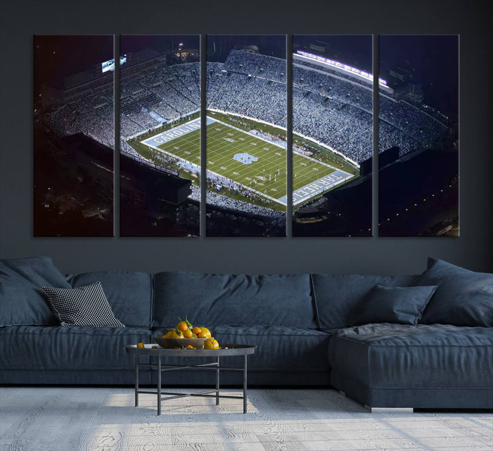 A University of North Carolina Tar Heels Football Team Print, showcasing Chapel Hill's Kenan Memorial Stadium, hangs in a modern dining room, adding a gallery-quality finish that enhances the entire space.