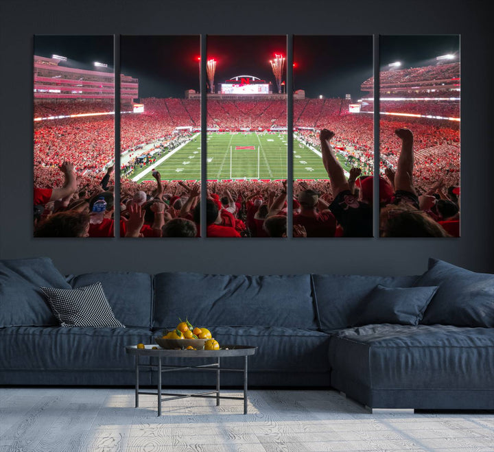 The University of Nebraska Cornhuskers Football Team Print, a vibrant three-panel canvas depicting Lincoln Memorial Stadium filled with enthusiastic fans from the end zone perspective, features a gallery-quality finish.