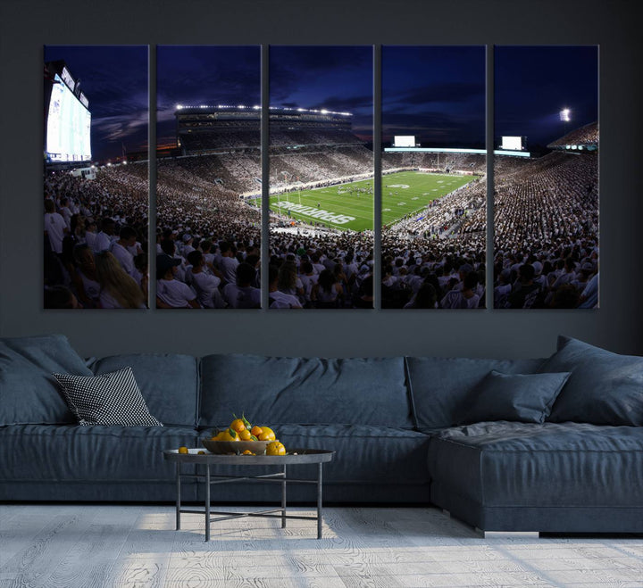 A packed football stadium at night, with bright lights and fans in white, depicted in a Michigan State Spartans Stadium wall art.