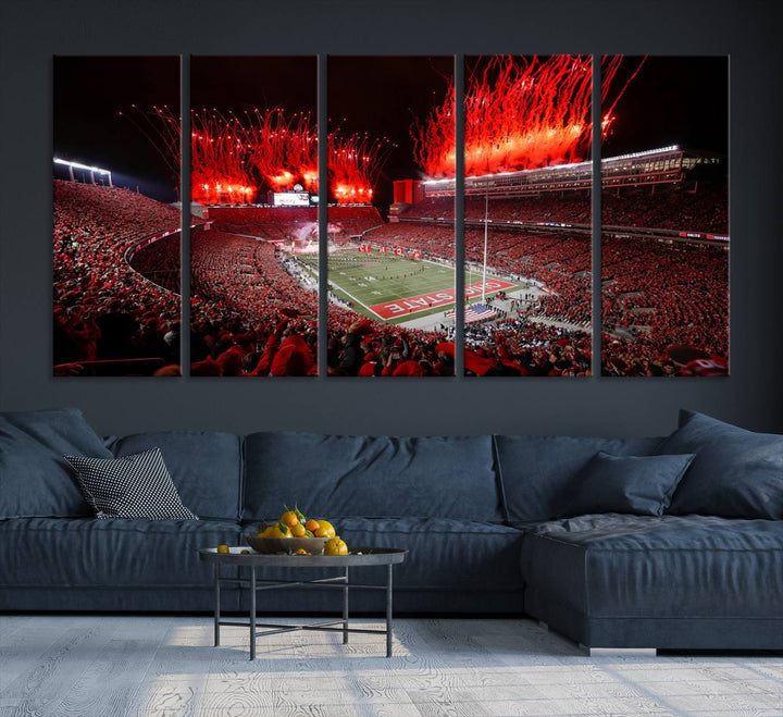 A vibrant red canvas art of a packed Ohio State Buckeyes stadium at night with fireworks.