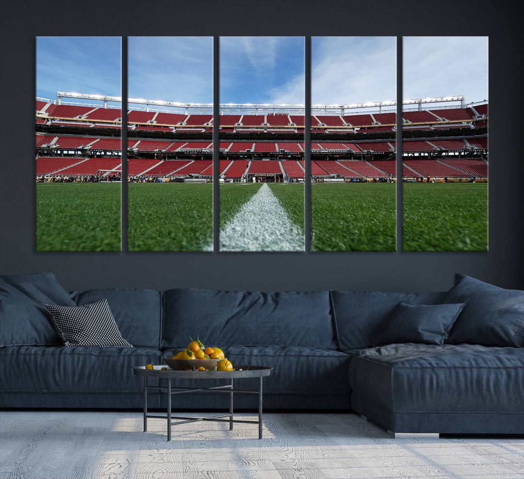 A canvas print of the University of Tulsa Golden Hurricane showcases H.A. Chapman Stadiums football field and red seats against a backdrop of a blue sky.