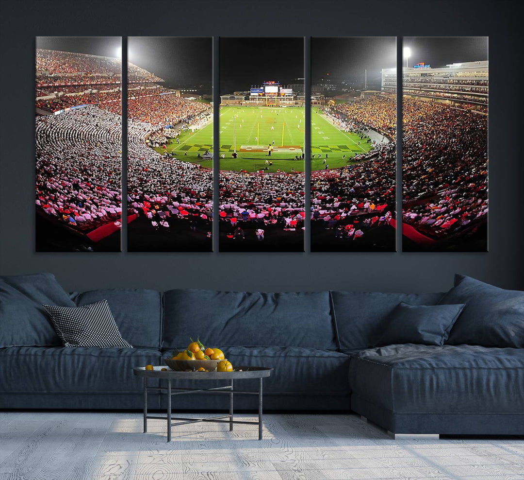 The Maryland Terrapins Football Wall Art Canvas showcases a packed SECU Stadium at night with a bright field and cheering fans.