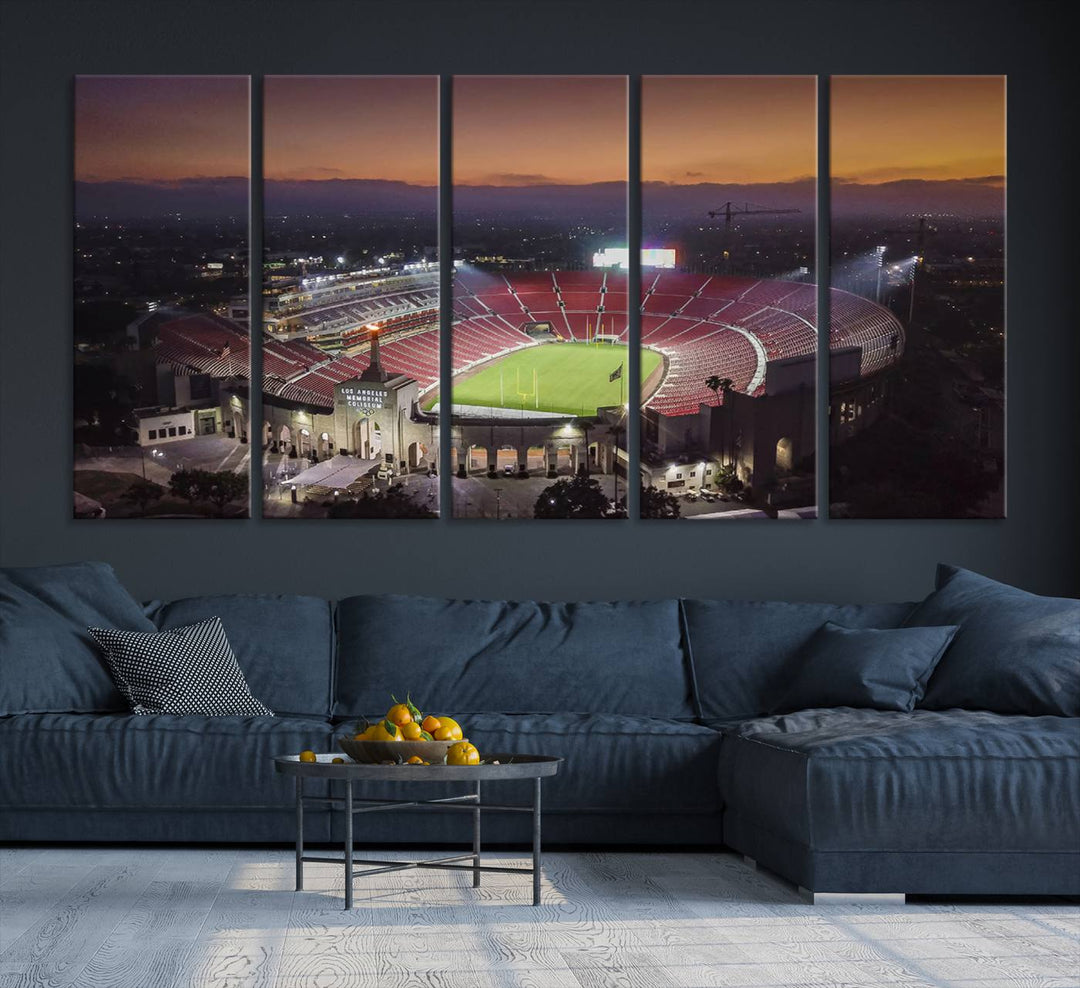 The USC Trojans Stadium canvas captures Memorial Coliseum at twilight, showcasing red seats and a green field beneath an orange sky.