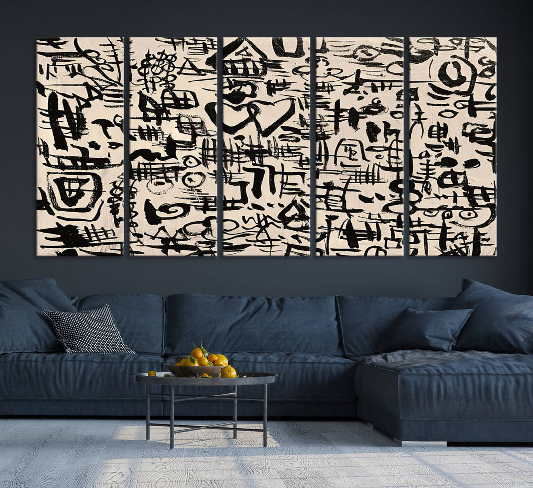 The Abstract Love and Chaos canvas is a museum-quality print featuring black symbols on a beige background, adorned with a heart and scribble design. It is framed to enhance its artistic appeal.