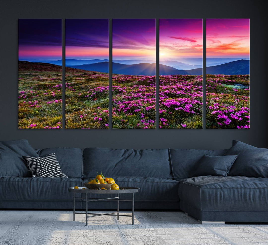 A 3-panel landscape photography canvas of a sunset over mountain meadows with purple wildflowers decorates the wall.