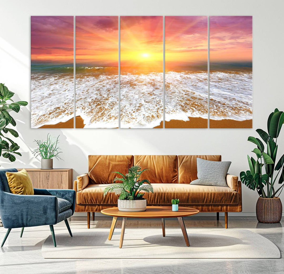 Golden Beach Sunrise 3-panel canvas art of ocean waves, hung on a wooden wall.