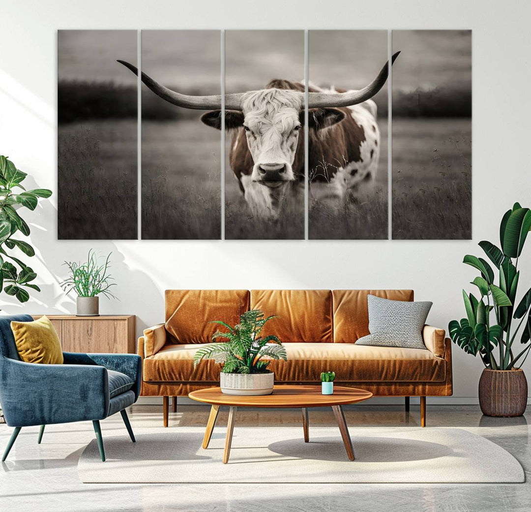 The Texas Longhorn Cow Canvas Wall Art Print adds a rustic touch to a living room.