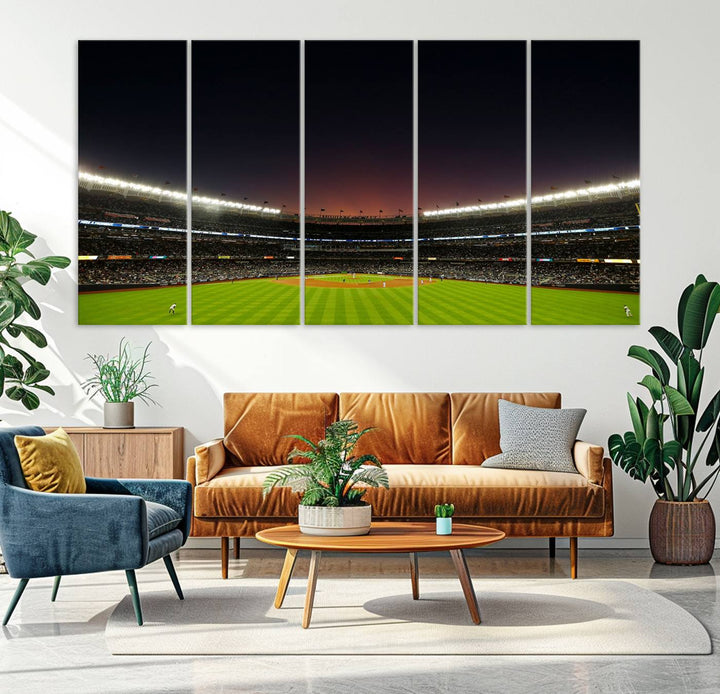 A night game at Yankee Stadium depicted on canvas beneath a sunset sky.