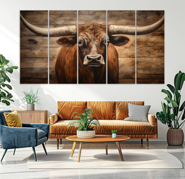 The Longhorn Bull Wall Art, a ready-to-hang canvas print, showcases an image of a brown longhorn cow set against a wooden background, perfect for those looking to enhance their space with rustic farmhouse and western barn decor.