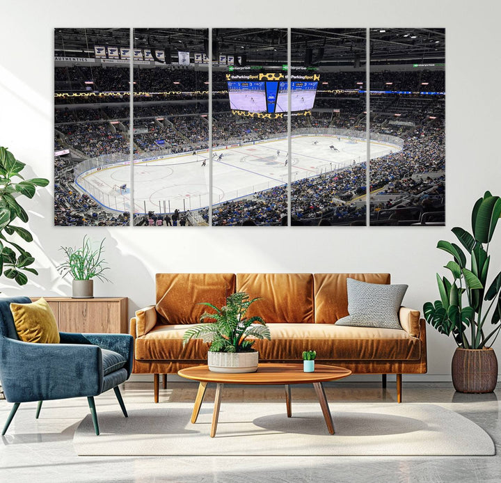 A large Enterprise Center canvas of a crowded hockey arena hangs prominently.