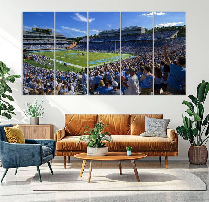 A gallery-quality canvas wall art print featuring the University of North Carolina Tar Heels Football Team and Chapel Hill's Kenan Memorial Stadium adorns the cafe wall.