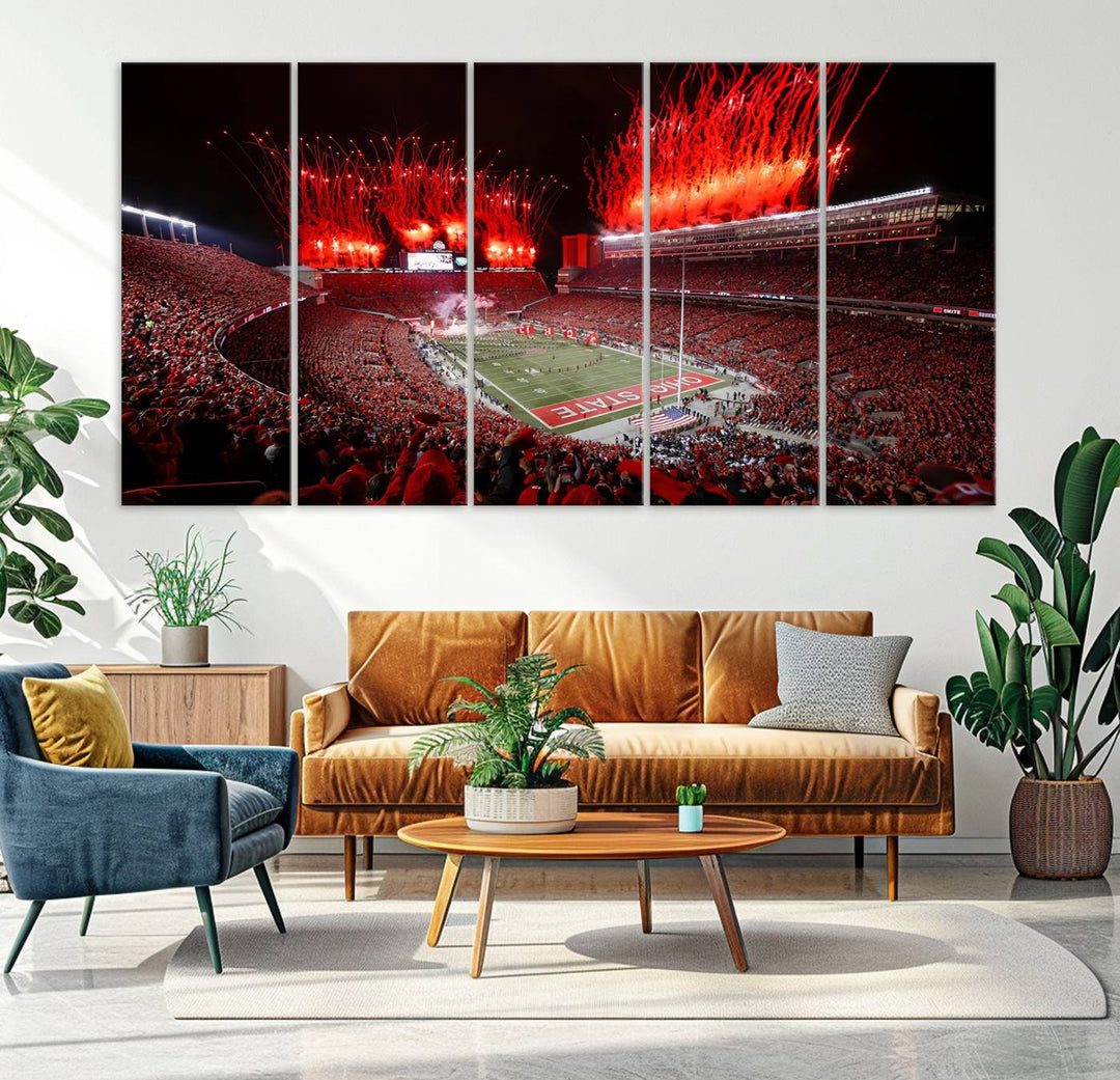 A vibrant red canvas art of a packed Ohio State Buckeyes stadium at night with fireworks.