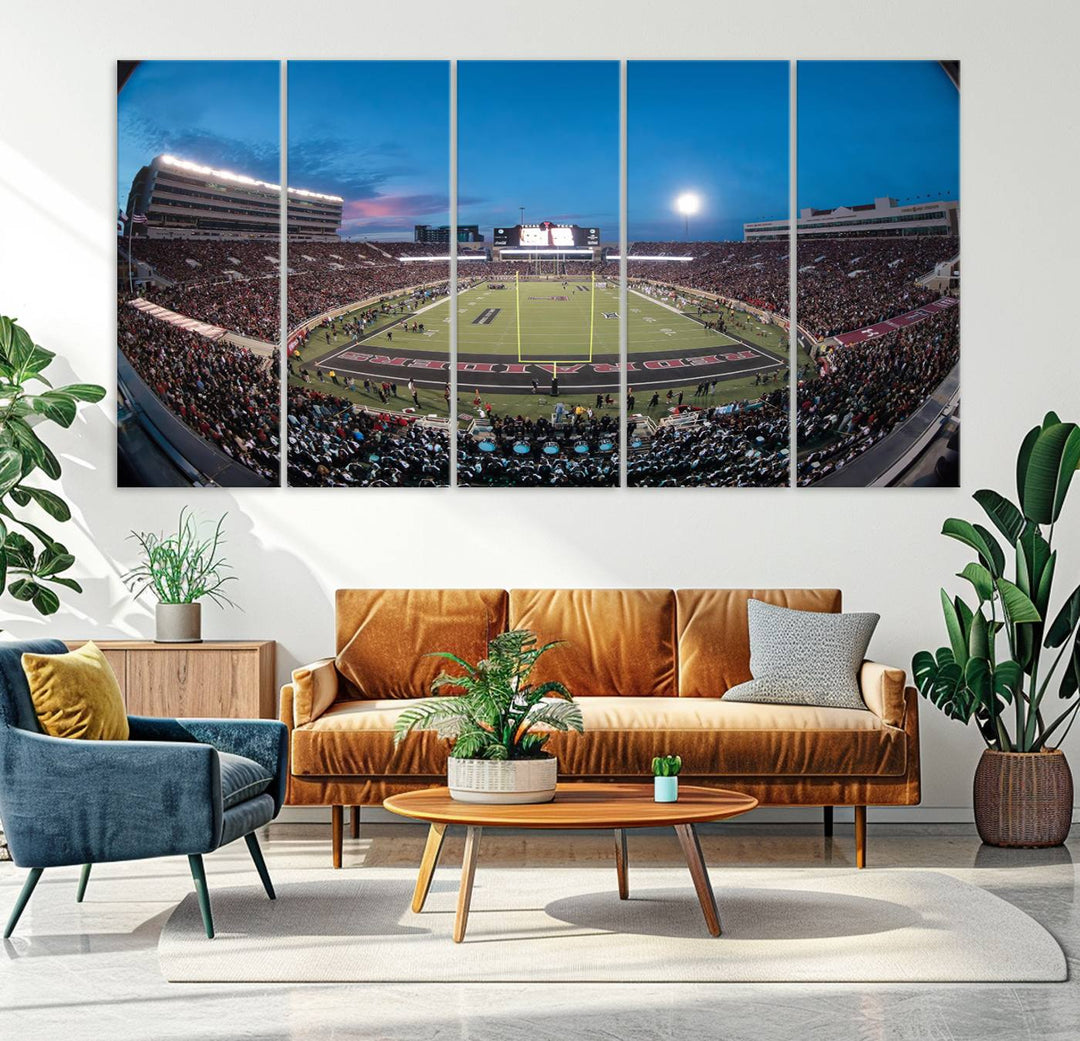 The wall art in the living room features a Texas Tech Red Raiders Football Team Print, showcasing Jones AT&T Stadium at dusk.