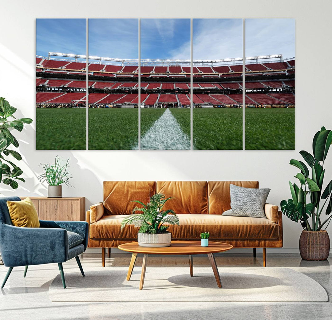 A canvas print of the University of Tulsa Golden Hurricane showcases H.A. Chapman Stadiums football field and red seats against a backdrop of a blue sky.