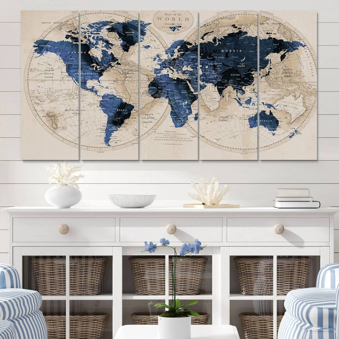 The Vintage Triptych Map Print is a grunge-stained blue and beige world map, perfect for enhancing wall decor.