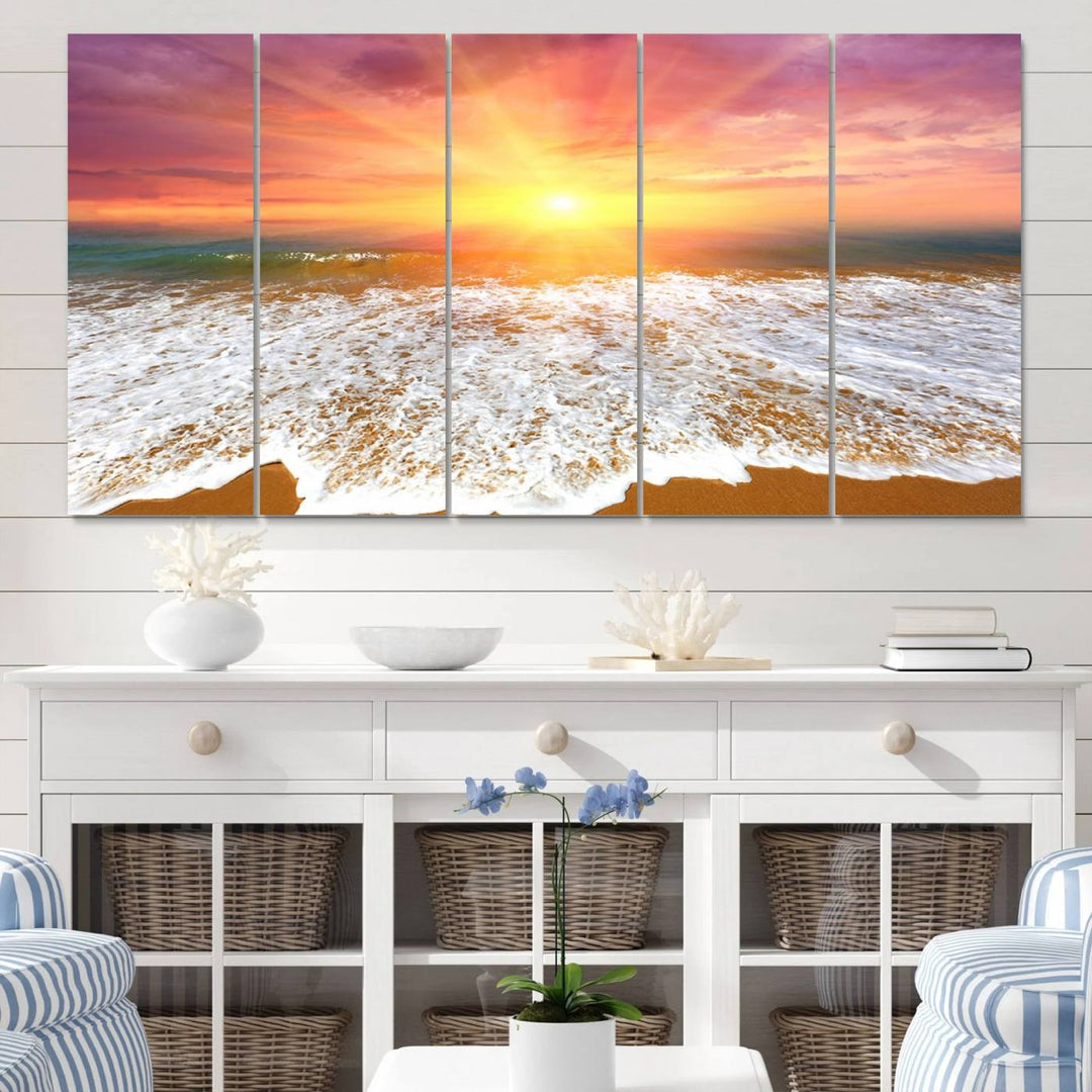 Golden Beach Sunrise 3-panel canvas art of ocean waves, hung on a wooden wall.