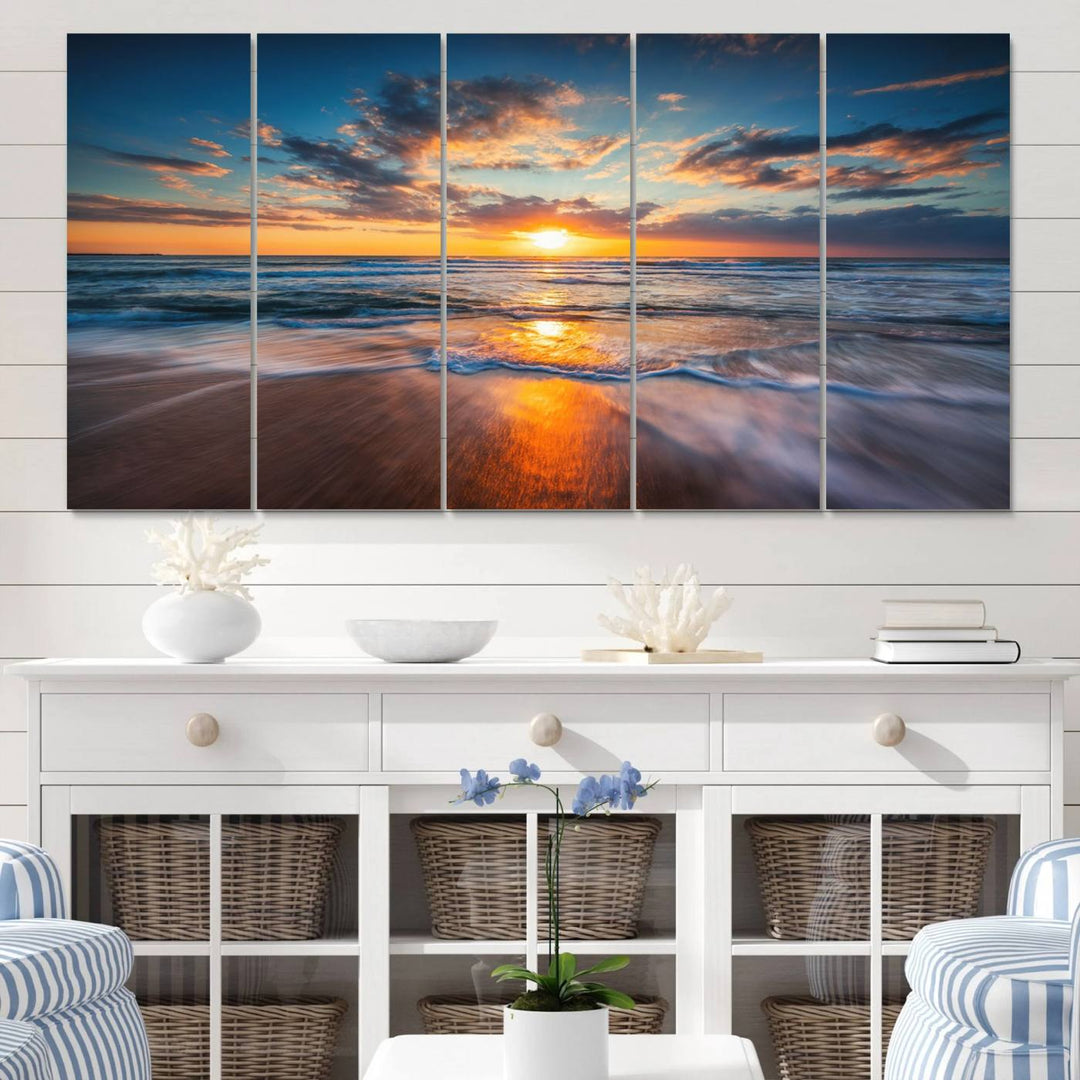 The Sunset on the Ocean canvas adds coastal ambiance to the wooden wall.