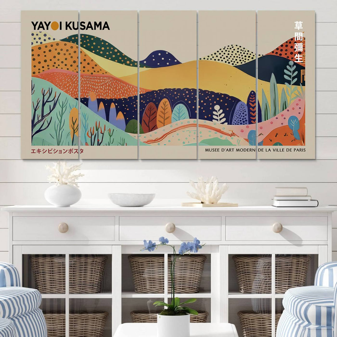 In a living room with contemporary décor, a vibrant abstract landscape by Yayoi Kusama from 1986 is prominently displayed.