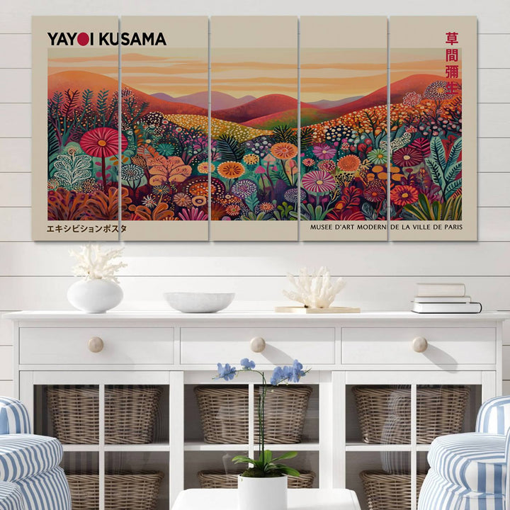 The room is adorned with a triptych artwork depicting colorful flowers and hills, incorporating the "Framed Yayoi Kusama 1986 Wall Art Print" – a vibrant abstract landscape canvas print that blends Japanese Wabi Sabi themes into contemporary nature-inspired décor.