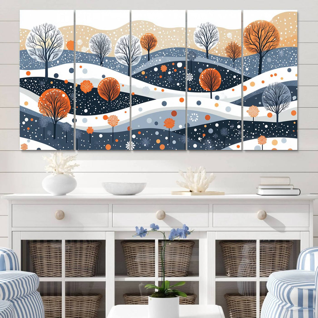 The "Abstract Winter Landscape Canvas Wall Art Print," featuring a triptych of landscapes with trees and hills in vibrant orange, white, and blue hues, adds a gallery-quality finish that transforms the space into an art lover's dream.