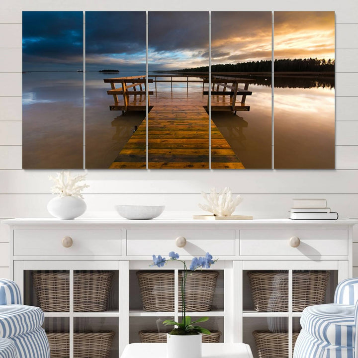 The "Serene Lake Pier at Sunset" landscape canvas print, crafted as ready-to-hang and framed wall art, enriches the contemporary setting by capturing the tranquility of a lakeside pier at sunset.