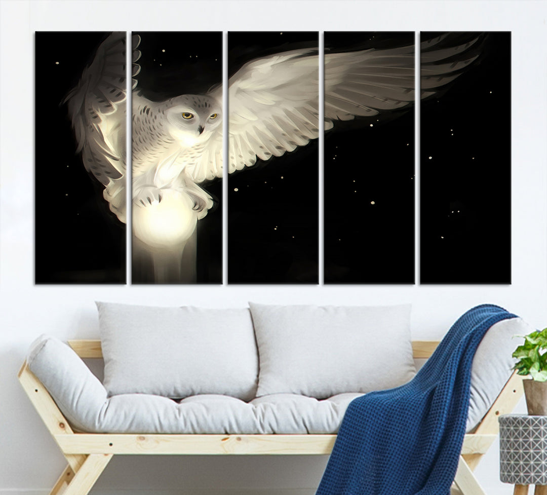 The Night Owl Art graces the wall with its depiction of a snowy owl on a glowing orb, perfect for modern decor.