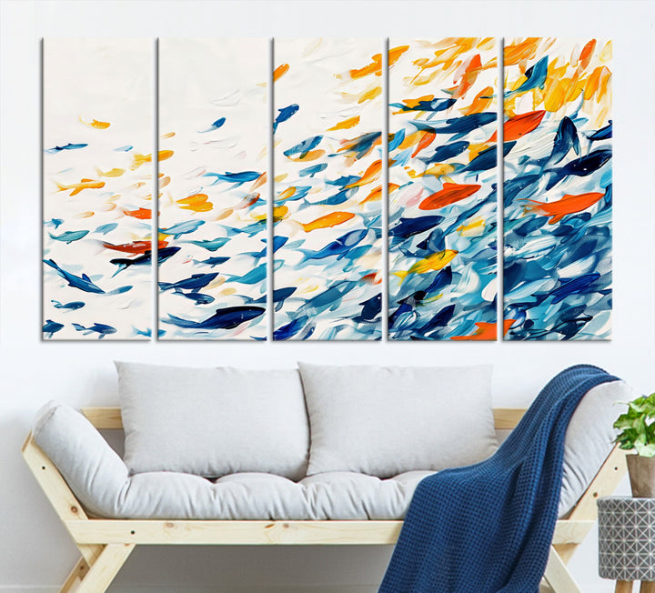 A colorful Abstract Fish Shoal Canvas Print hangs on the wall.