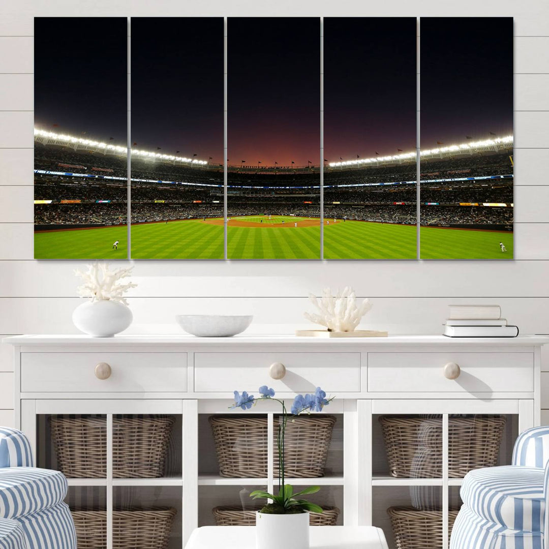 A night game at Yankee Stadium depicted on canvas beneath a sunset sky.