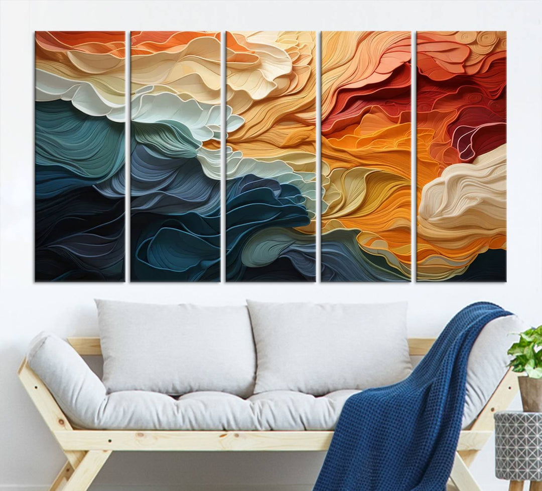 A Blue Orange Abstract Wave Wall Art Canvas Print adorns the wall. This colorful masterpiece is professionally hand-assembled to enhance any space.