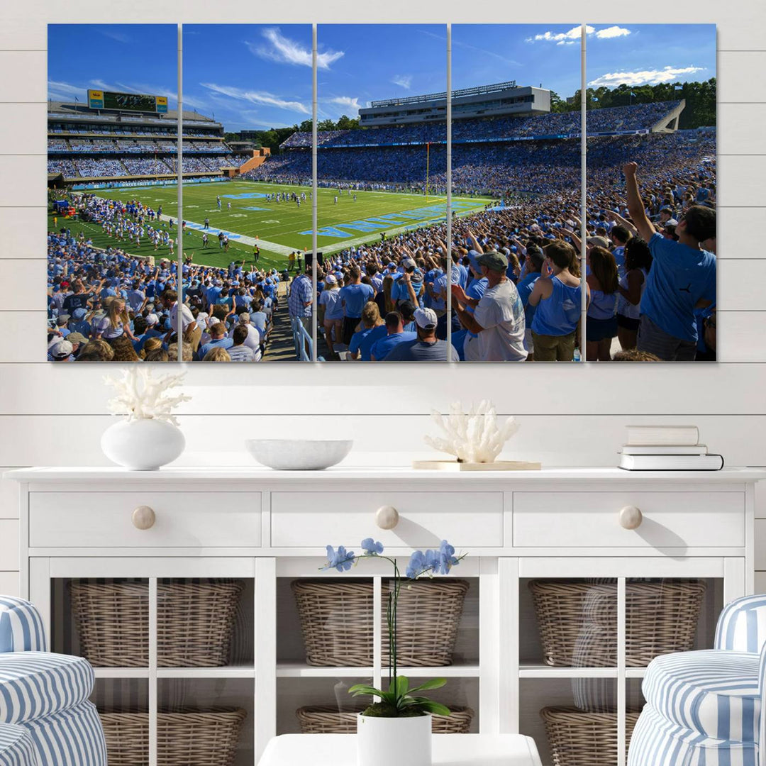 A gallery-quality canvas wall art print featuring the University of North Carolina Tar Heels Football Team and Chapel Hill's Kenan Memorial Stadium adorns the cafe wall.