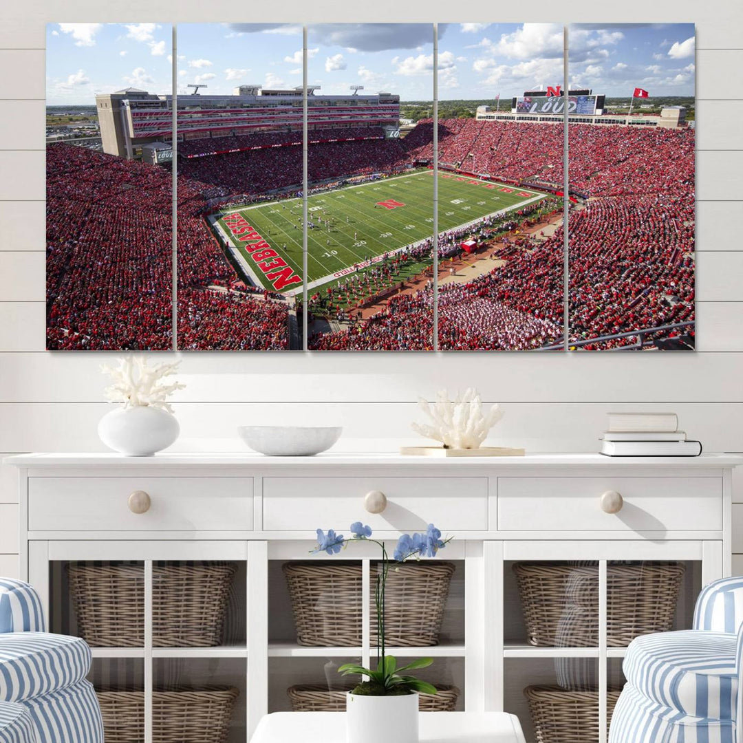 The University of Nebraska Cornhuskers Football Team Print showcases a vibrant triptych of Lincoln Memorial Stadium, depicting a packed football stadium filled with energetic fans. This handmade art piece is crafted in the USA and printed on premium canvas for a gallery-quality finish.