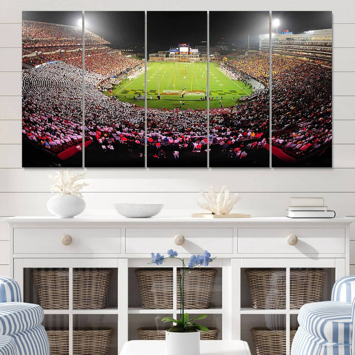 The Maryland Terrapins Football Wall Art Canvas showcases a packed SECU Stadium at night with a bright field and cheering fans.