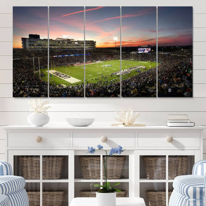 This wall art canvas print captures UCONN Huskies fans energizing a sunset scene at East Hartfords Pratt & Whitney Stadium.