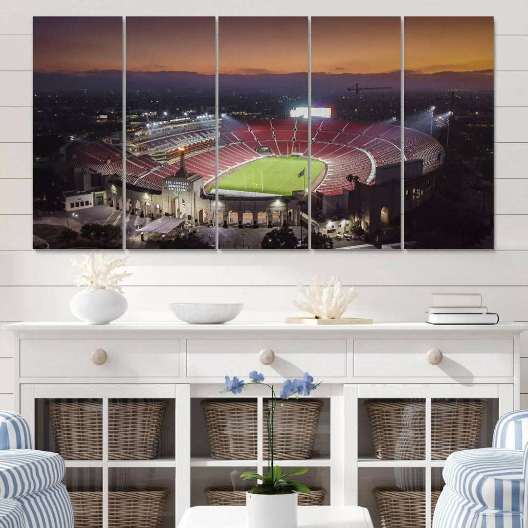 The USC Trojans Stadium canvas captures Memorial Coliseum at twilight, showcasing red seats and a green field beneath an orange sky.