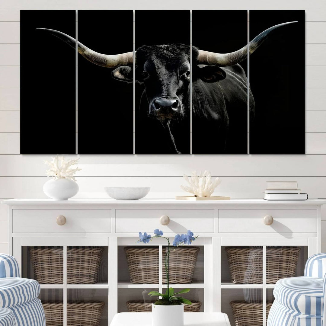 The Texas Black Longhorn Bull Canvas Print, featuring large curved horns set against a dark background, is ideal for Western decor.