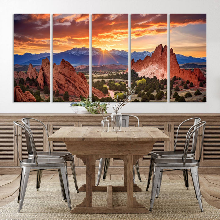 A vibrant sunset over the Rocky Mountains with red rocks.