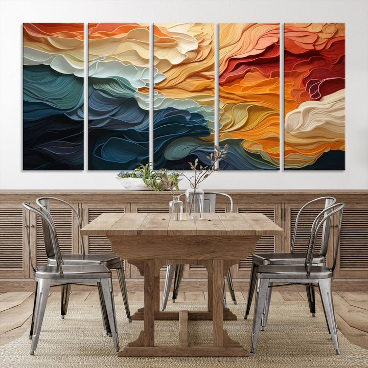 A Blue Orange Abstract Wave Wall Art Canvas Print adorns the wall. This colorful masterpiece is professionally hand-assembled to enhance any space.