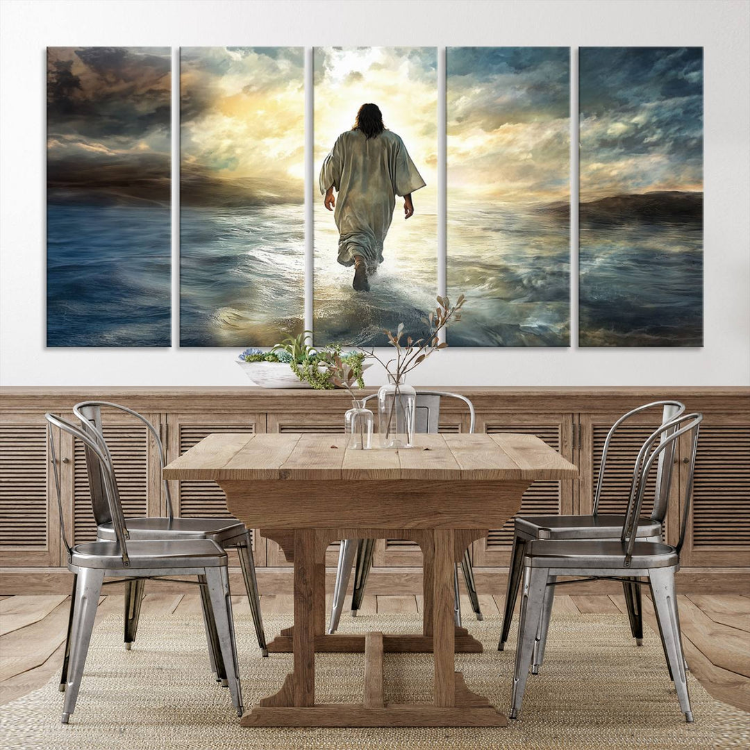 The Jesus Walking on Water Wall Art, a captivating triptych canvas print, showcases a person walking on water beneath dramatic clouds. This ready-to-hang piece seamlessly combines faith and style for your Christian home decor.