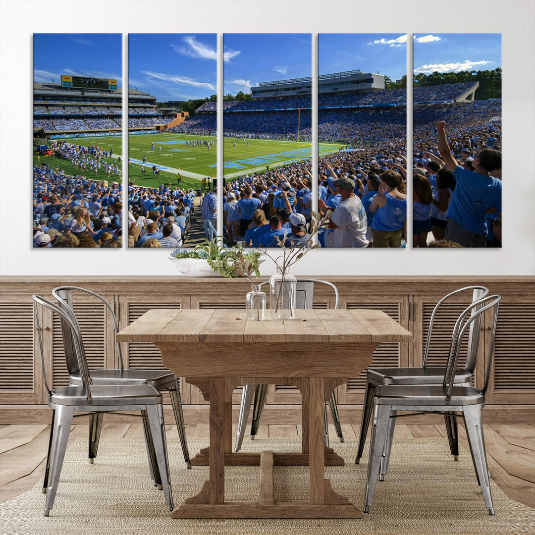 A gallery-quality canvas wall art print featuring the University of North Carolina Tar Heels Football Team and Chapel Hill's Kenan Memorial Stadium adorns the cafe wall.