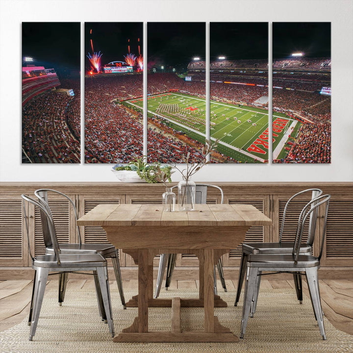 The University of Nebraska Cornhuskers Football Team Print, featuring Lincoln Memorial Stadium in a vibrant triptych canvas with fireworks above and a gallery-quality finish, is elegantly displayed.