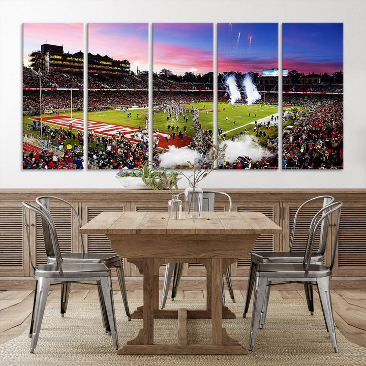 The wall art features a canvas print of the Stanford Cardinal football team, capturing players, fireworks, and smoke against the backdrop of a sunset at Stanford Stadium.