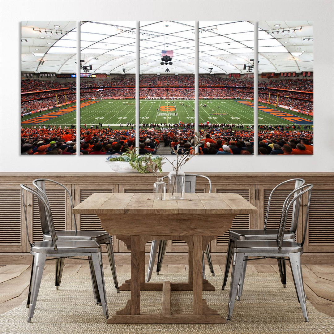 Fans fill the Syracuse JMA Wireless Dome, highlighted in orange and blue under a vaulted roof on this premium canvas print of the scene.