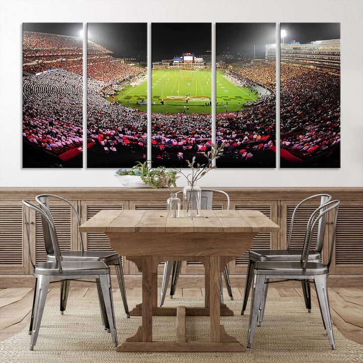 The Maryland Terrapins Football Wall Art Canvas showcases a packed SECU Stadium at night with a bright field and cheering fans.