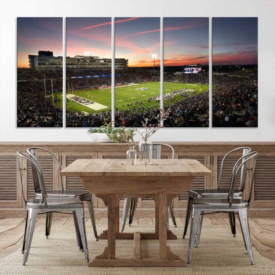 This wall art canvas print captures UCONN Huskies fans energizing a sunset scene at East Hartfords Pratt & Whitney Stadium.