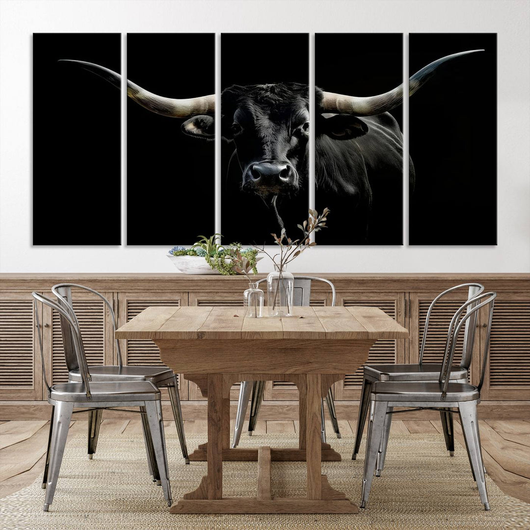 The Texas Black Longhorn Bull Canvas Print, featuring large curved horns set against a dark background, is ideal for Western decor.