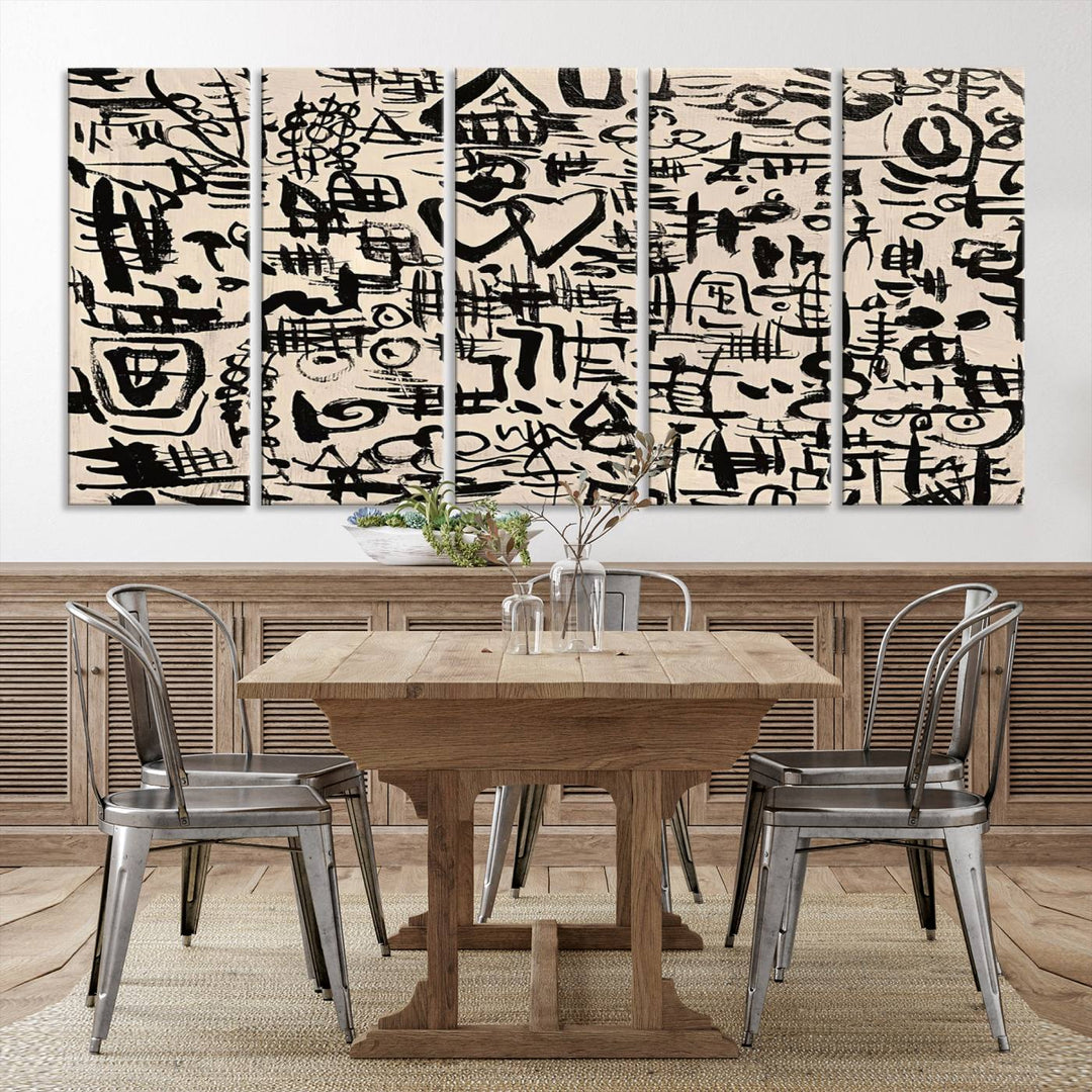 The Abstract Love and Chaos canvas is a museum-quality print featuring black symbols on a beige background, adorned with a heart and scribble design. It is framed to enhance its artistic appeal.