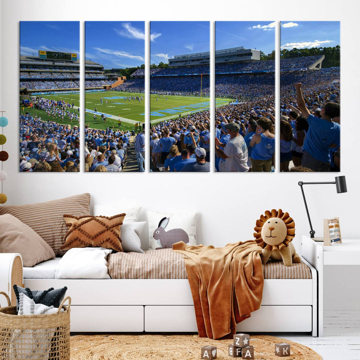 A gallery-quality canvas wall art print featuring the University of North Carolina Tar Heels Football Team and Chapel Hill's Kenan Memorial Stadium adorns the cafe wall.